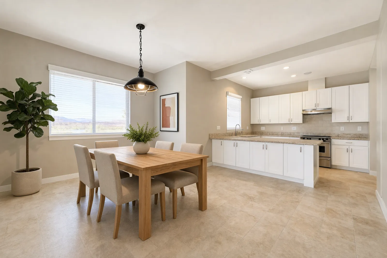 Dining area staged with a table and chairs